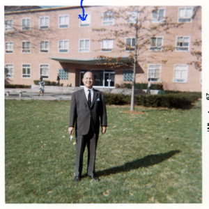 Rosendo posing in front of his office (blue arrow) at Howard University.